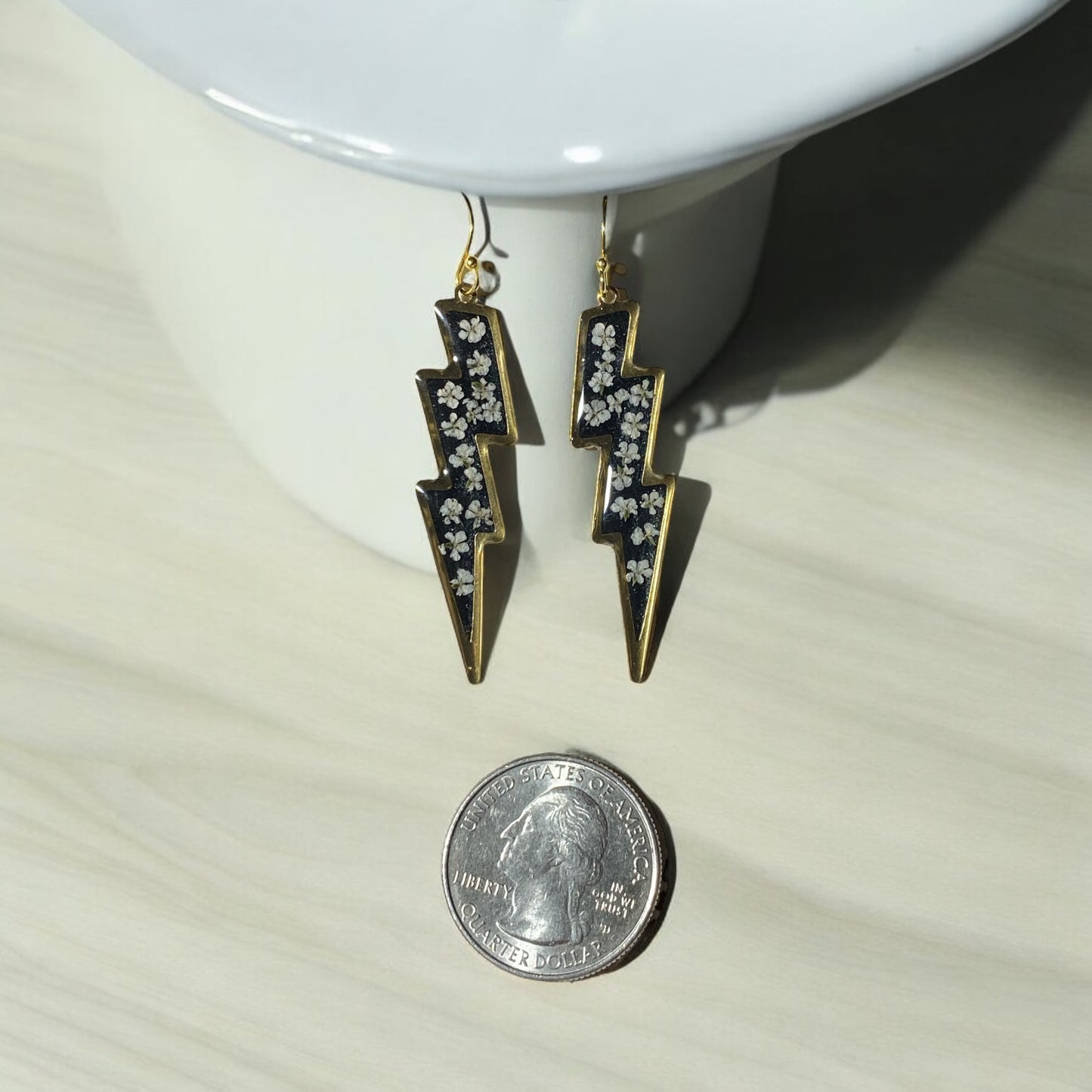 Lightening Bolts filled with Black Mica Powder and pieces of Queen Anne’s Lace filled in