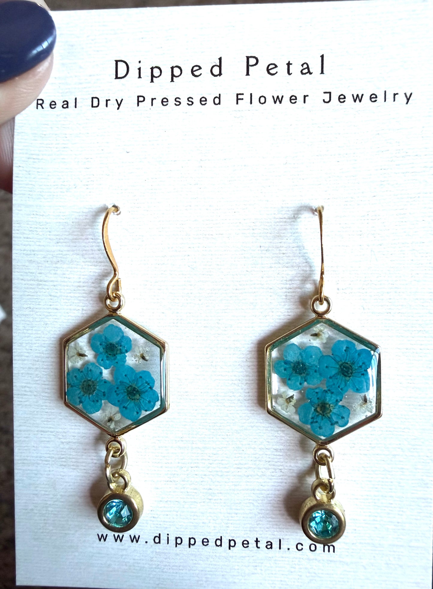 Teal Blue Colored Plum Blossoms and Pieces of Queen Anne’s Lace with a Teal Colored Charm