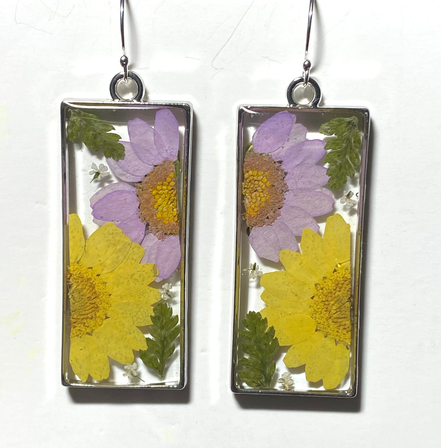 Split Yellow and Purple Daisies with pieces of Queen Anne’s Lace and Fern