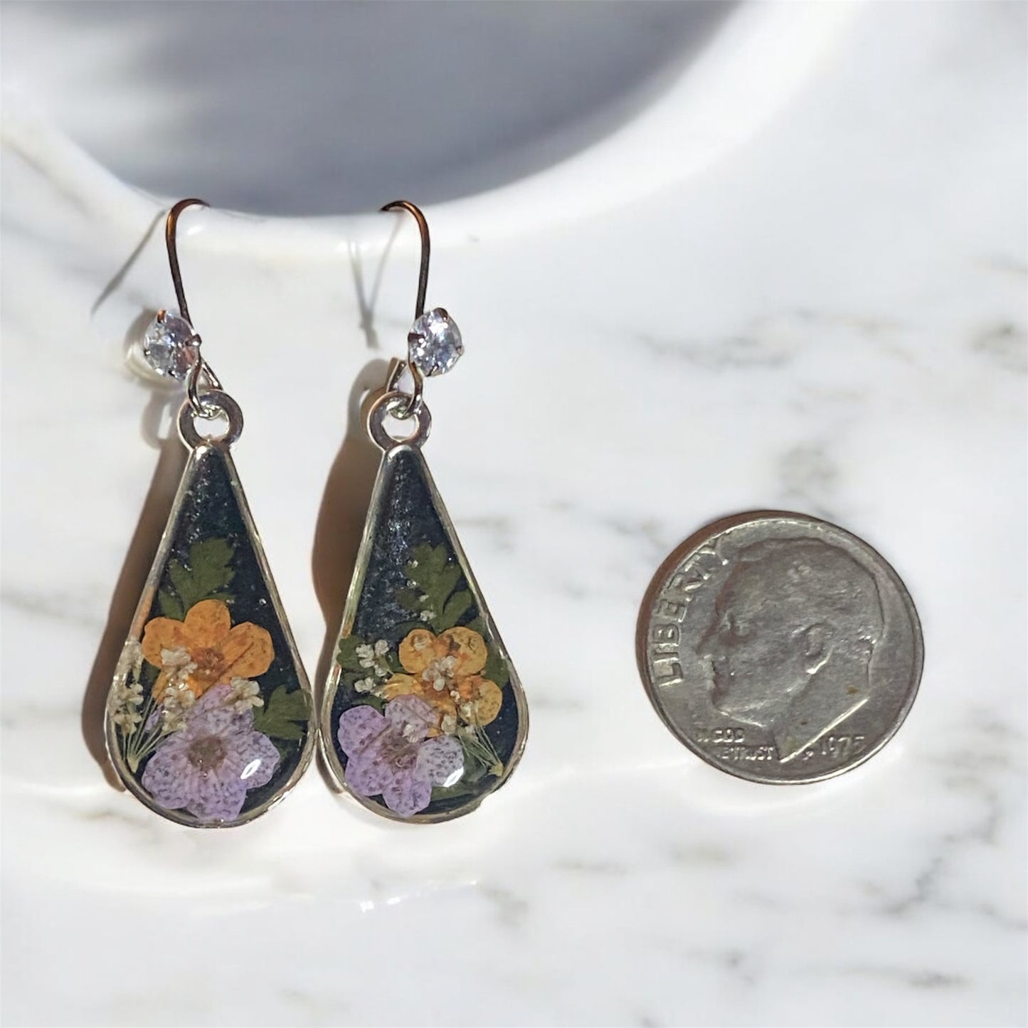 Black Mica Powder with Orange and Light Purple Plum Blossoms, Dry Pressed Fern, and Pieces of Queen Anne’s Lace