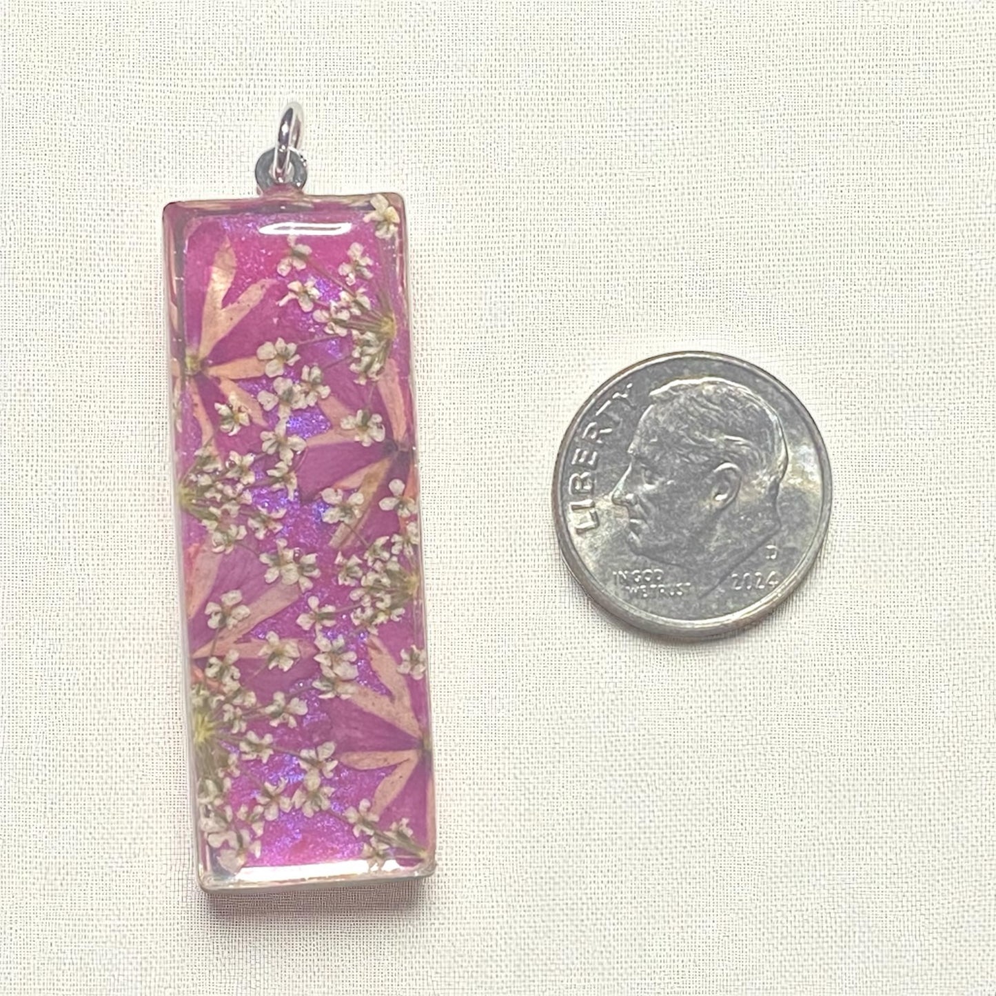Wisteria Pink Colored Mica Powder Background with Queen Anne’s Lace and Split Verbena