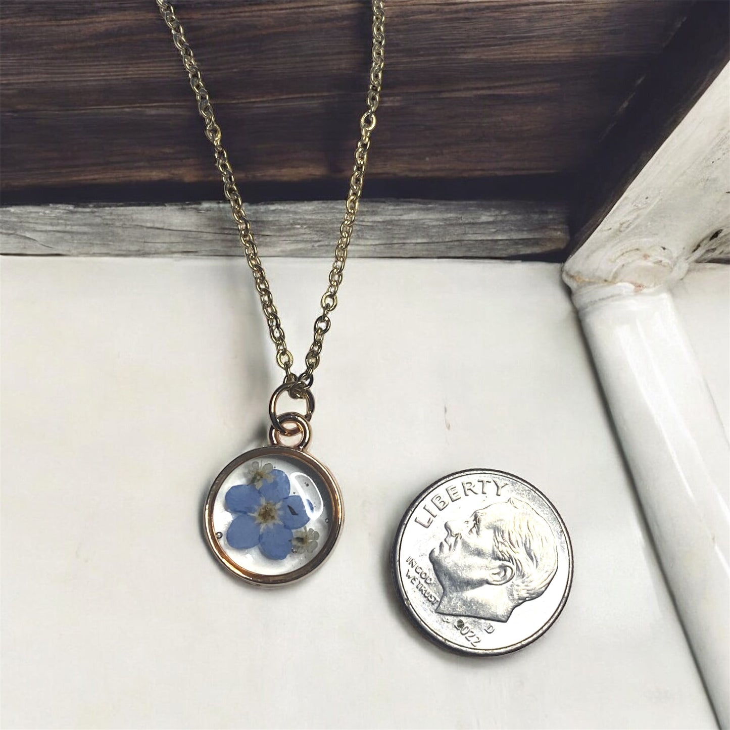 Dainty Rose Gold Bezel with Blue Forget-Me-Nots and Pieces of Queen Anne’s Lace on a Brass chain