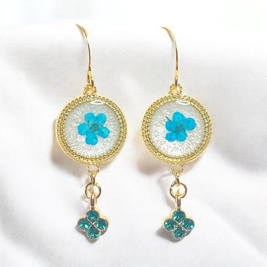 Opal-/White Colored Mica Powder with Teal Plum Blossoms and a Green Rhinestone Charm