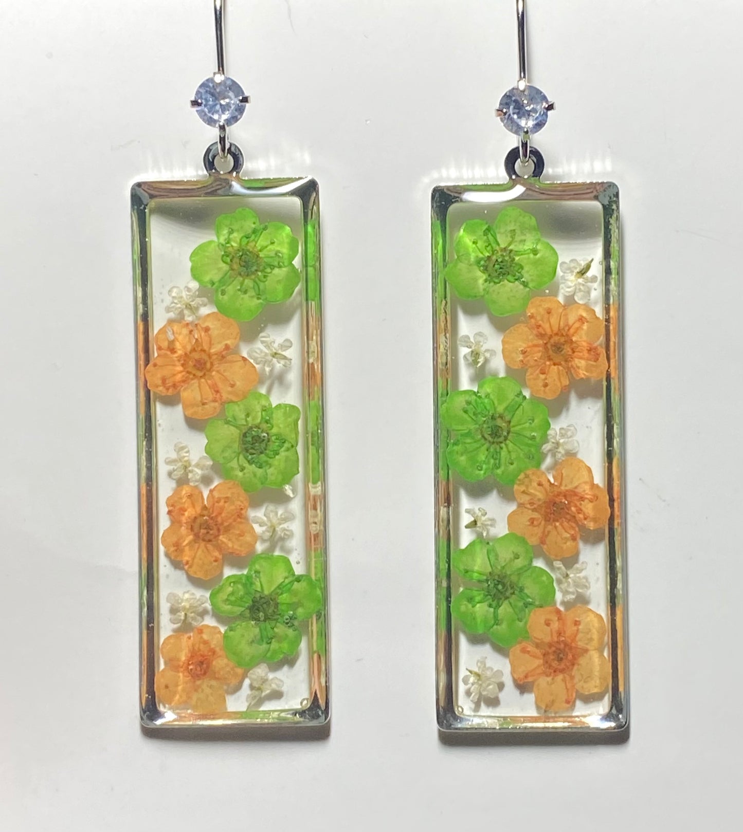 Green and Orange Plum Blossom Flowers with pieces of Queen Anne’s Lace