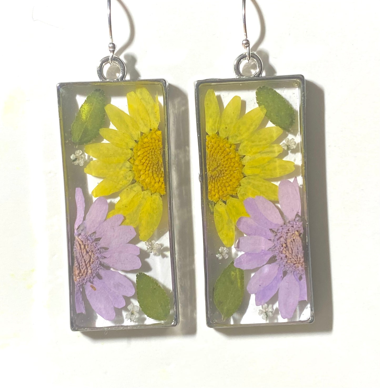 Split Yellow and Purple Daisies with Dry Pressed Leaves and Pieces of White Queen Anne’s Lace