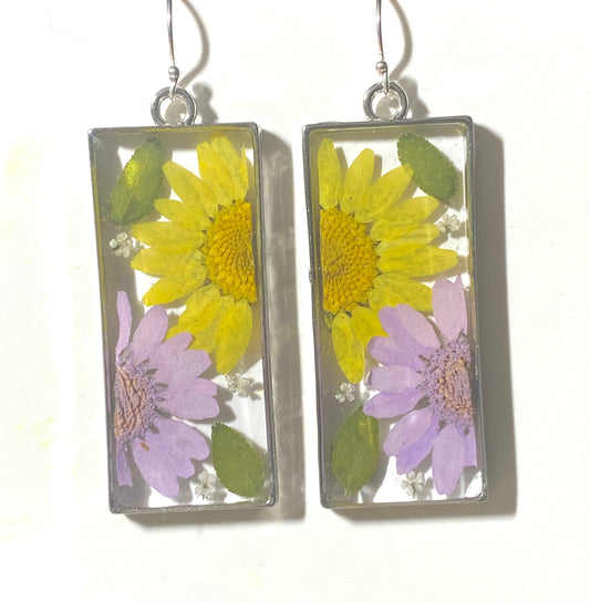 Split Yellow and Purple Daisies with Dry Pressed Leaves and Pieces of White Queen Anne’s Lace