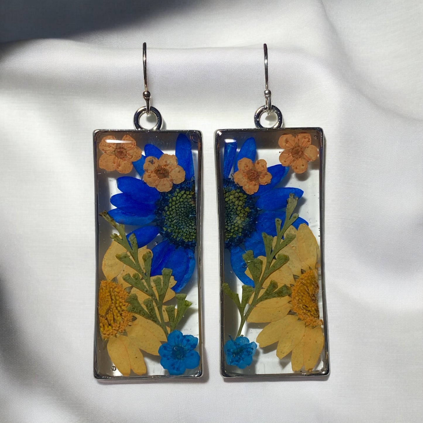 Split Orange and Blue Daisies, with Dry Pressed Fern, and Orange and Blue Plum Blossoms