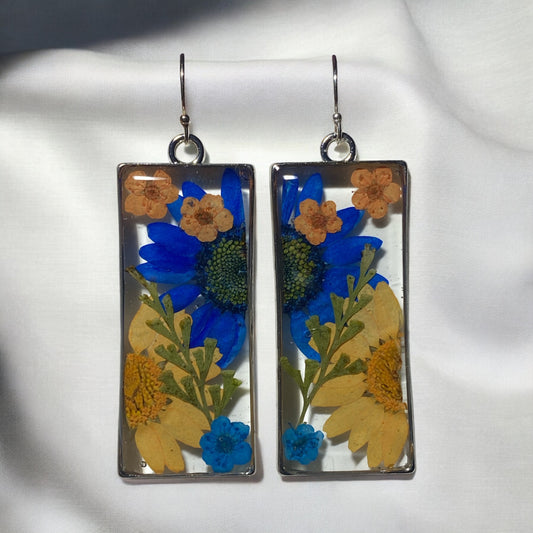 Split Orange and Blue Daisies, with Dry Pressed Fern, and Orange and Blue Plum Blossoms