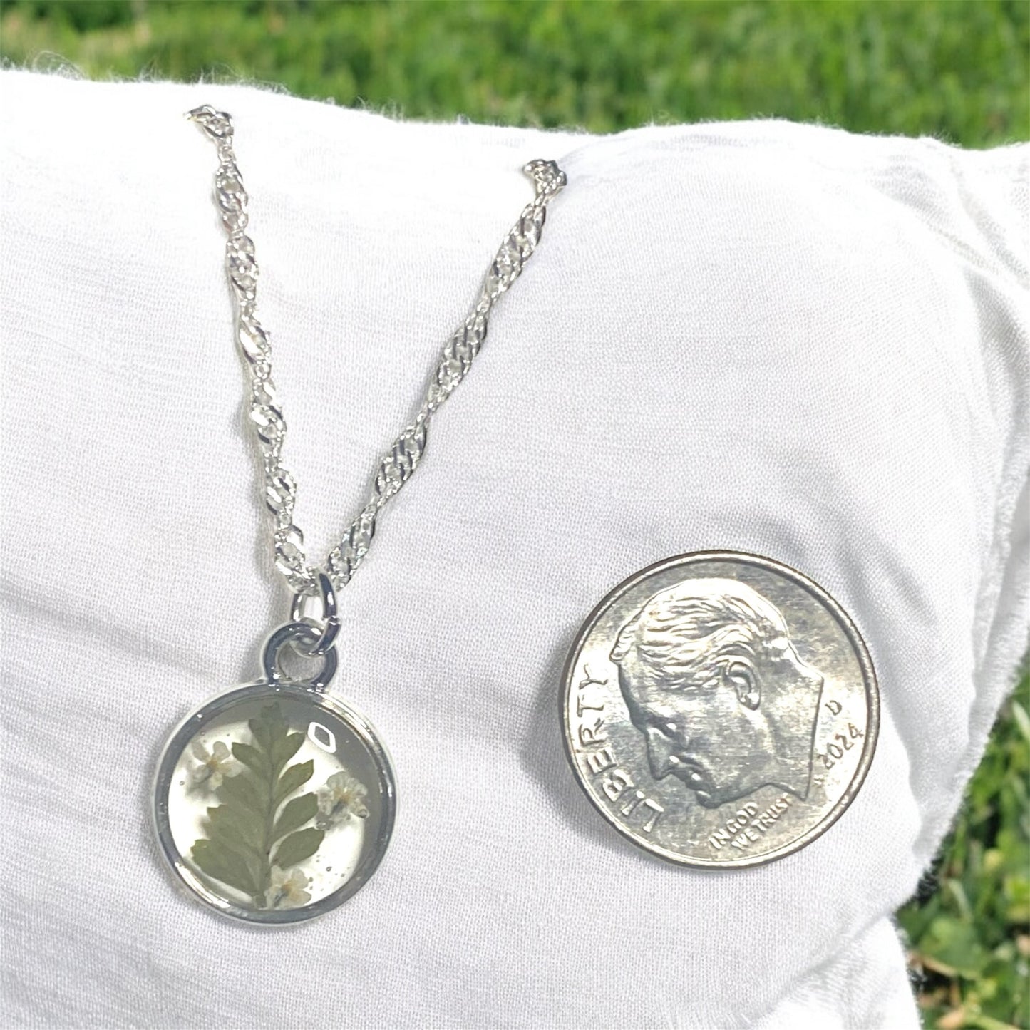 Silver Colored Dainty Necklace with Dry Pressed Fern and Pieces of Queen Anne’s Lace on a