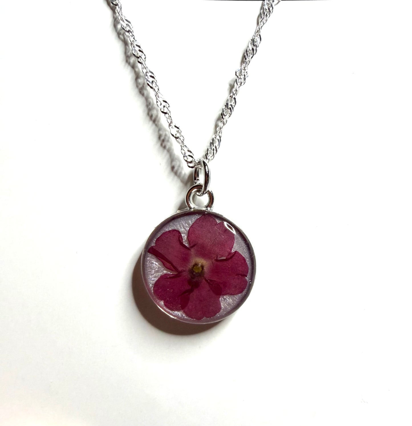 Opal Colored Mica Powder with a Red Verbena on top