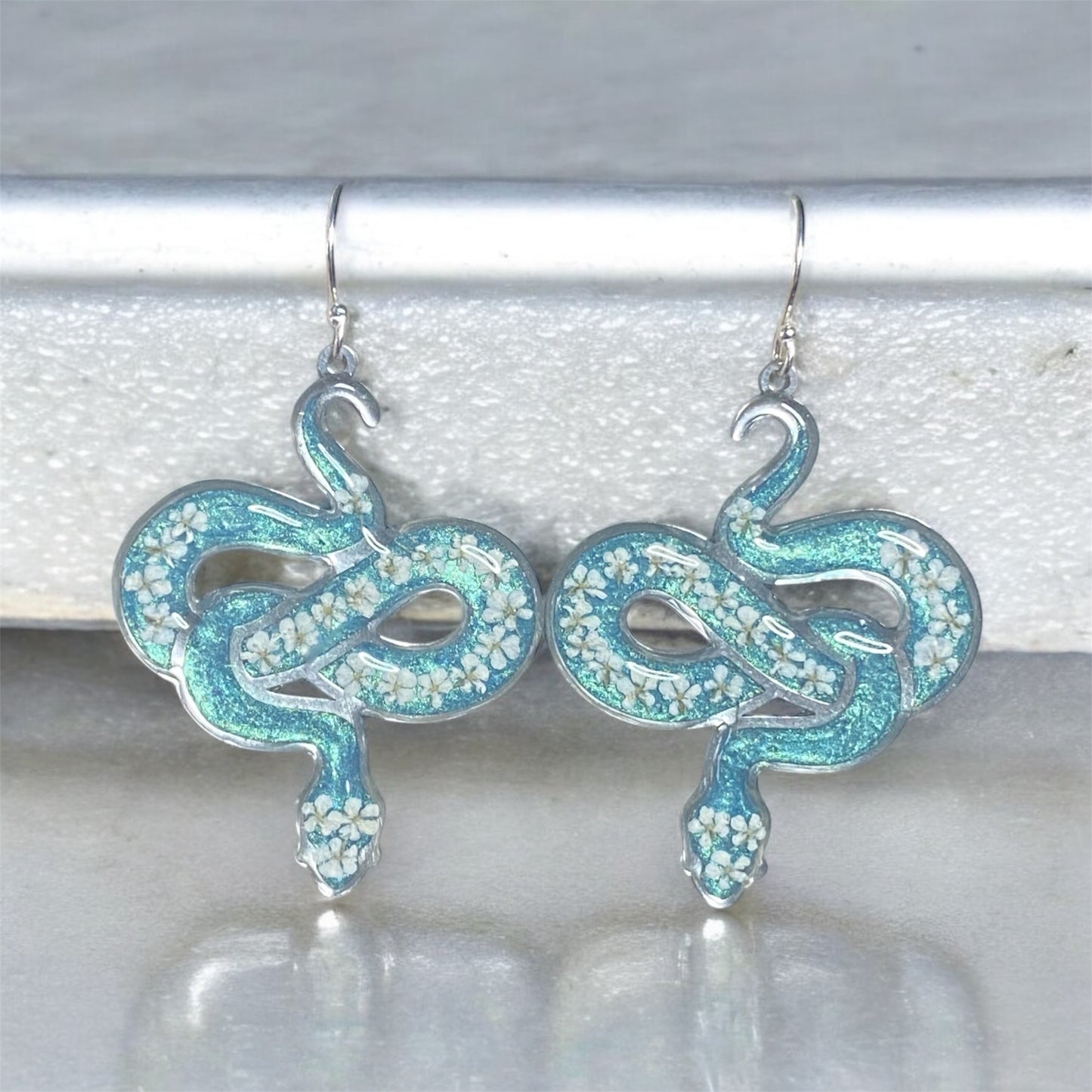 Snake Bezels with Dry Pressed pieces of Queen Anne’s Lace with Teal Mica Powder