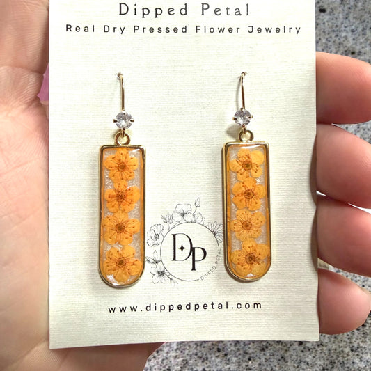 Opal Colored Mica Powder Background with Orange Plum Blossoms