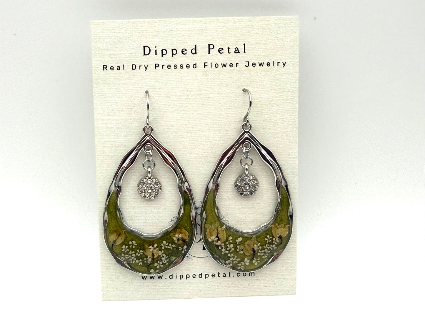 Green Mica Powder with Lily of the Valley, and Queen Anne’s Lace with dangling charms