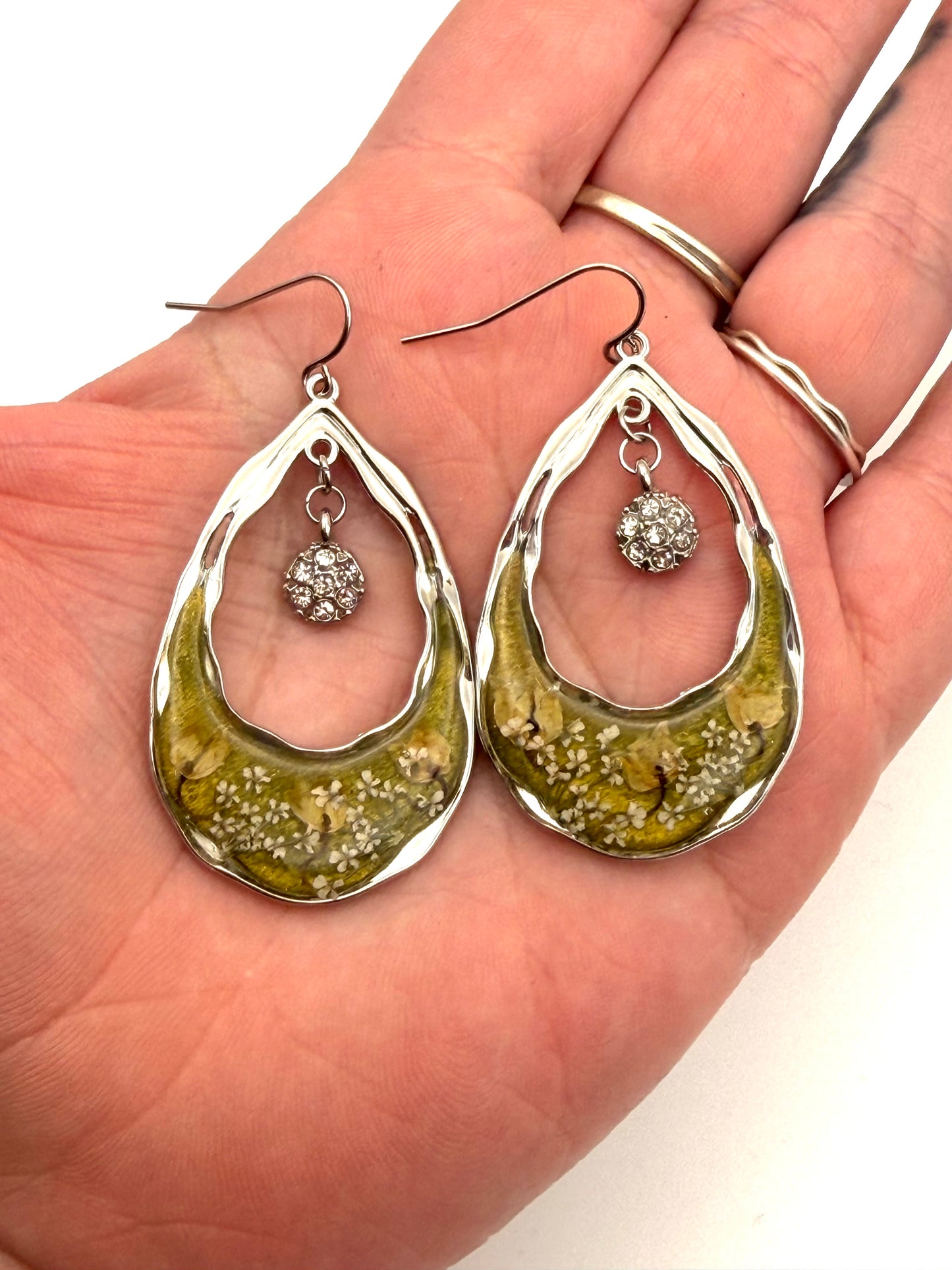 Green Mica Powder with Lily of the Valley, and Queen Anne’s Lace with dangling charms