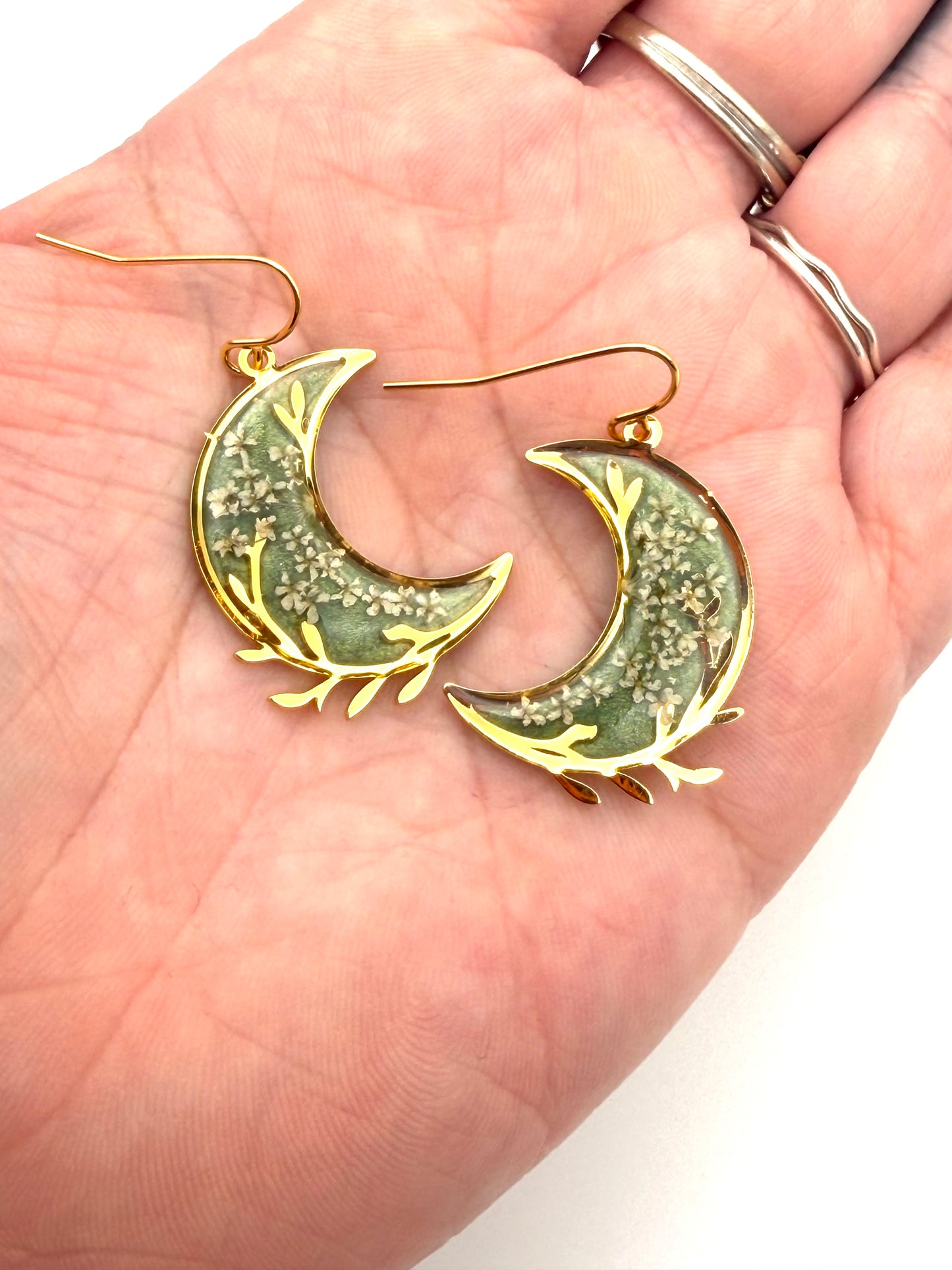 Gold Plated Crescent Moons filled with Aquamarine Green Mica Powder and Queen Anne’s Lace