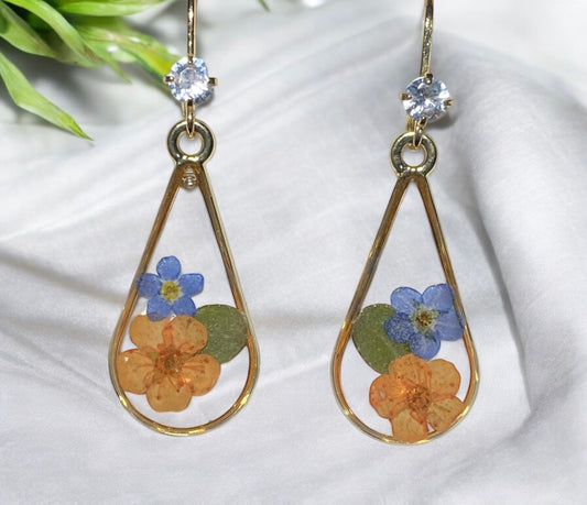 Orange Plum Blossoms with Blue Forget-Me-Nots and piece of Dry Pressed Leaves