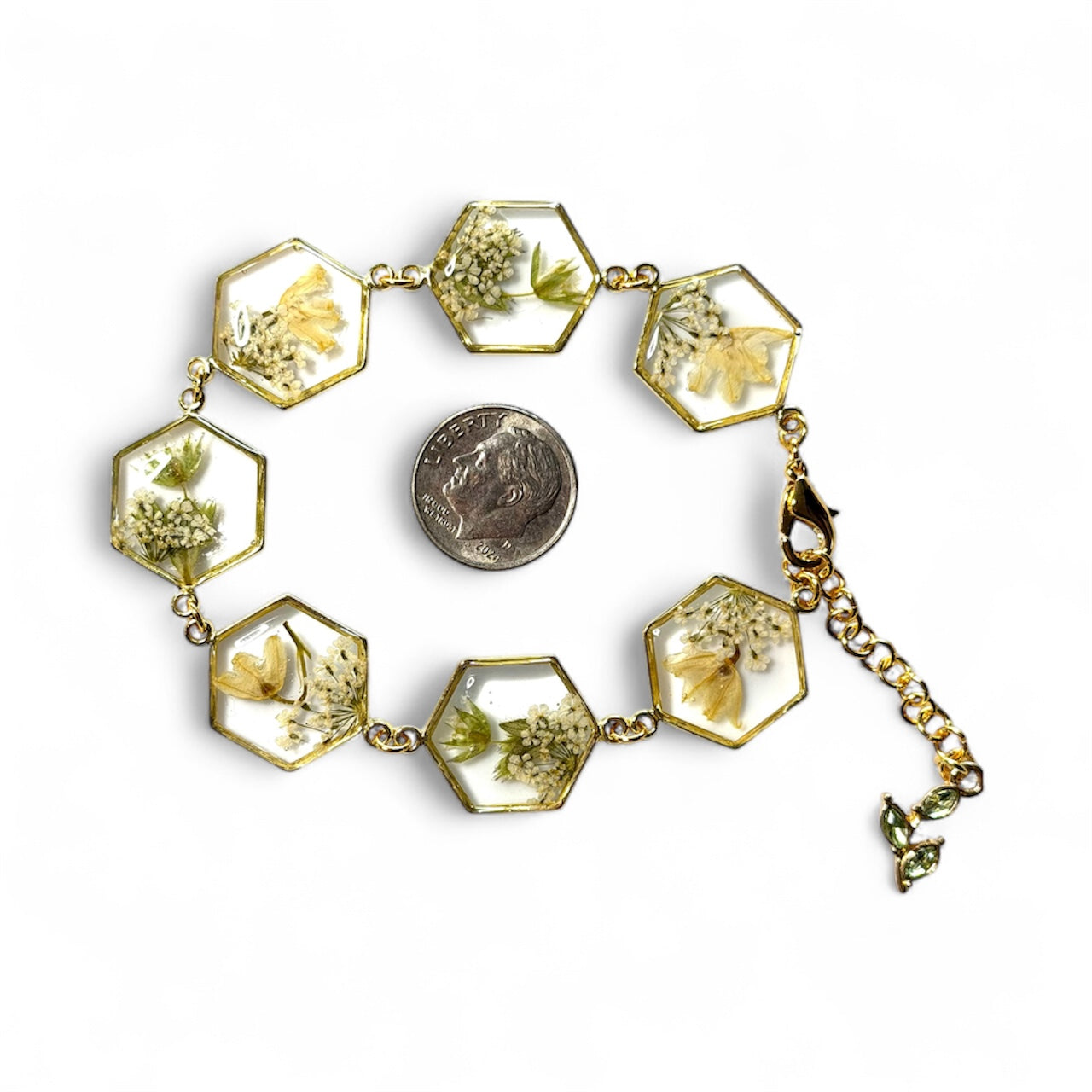 Gold Colored Bracelet with Lily of the Valley, Wild Flower and Queen Anne’s Lace with a Green Gemstone Leaf Charm