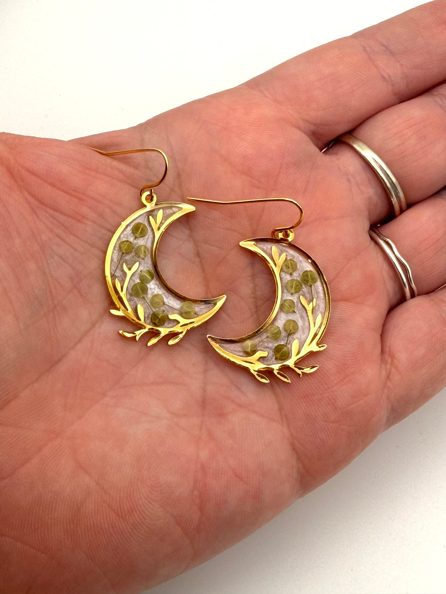 Gold Plated Crescent Moons filled with Opal Mica Powder and Pieces of Pepperweed