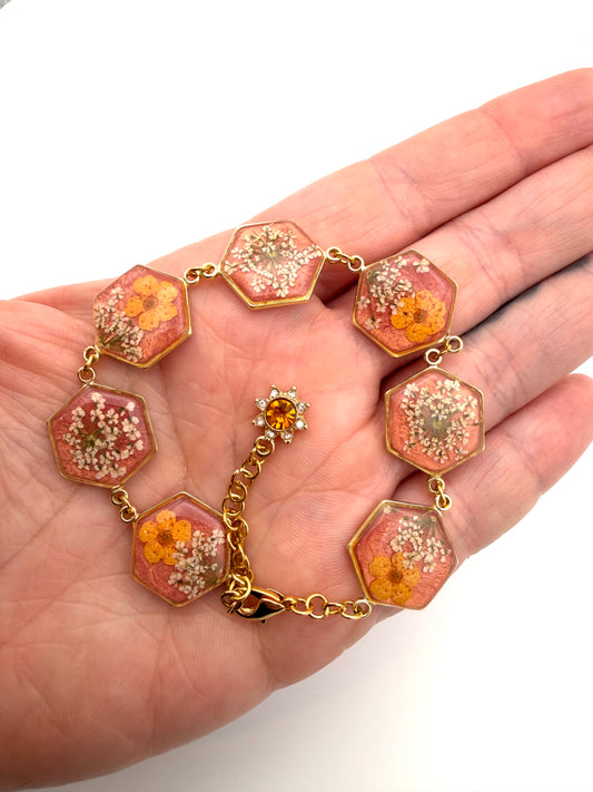 Gold Colored Bracelet with Coral Colored Mica Powder, Orange Plum Blossoms and Queen Anne’s Lace