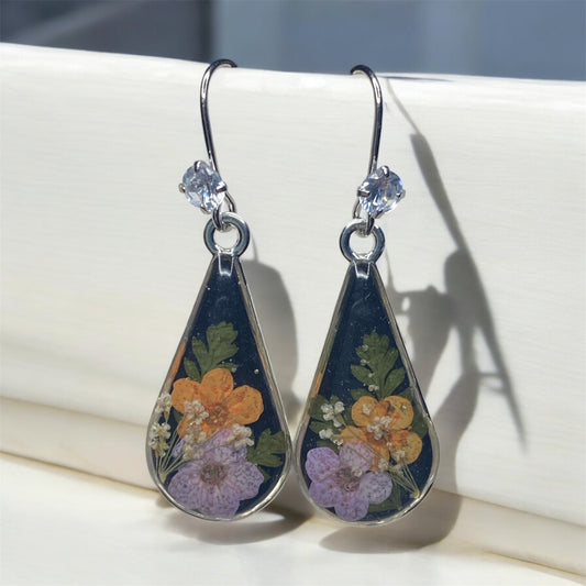 Black Mica Powder with Orange and Light Purple Plum Blossoms, Dry Pressed Fern, and Pieces of Queen Anne’s Lace