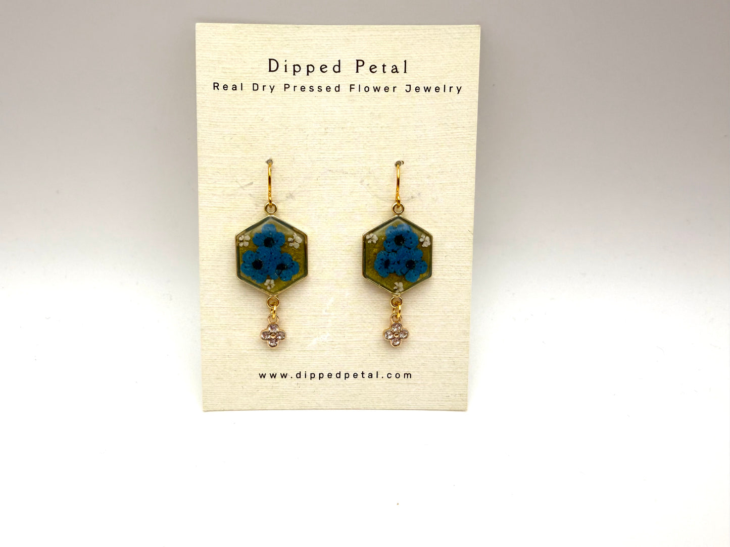 Green Colored Mica Powder with Blue Plum Blossoms, Pieces of Queen Anne’s Lace and a Dangling Rhinestone Charm