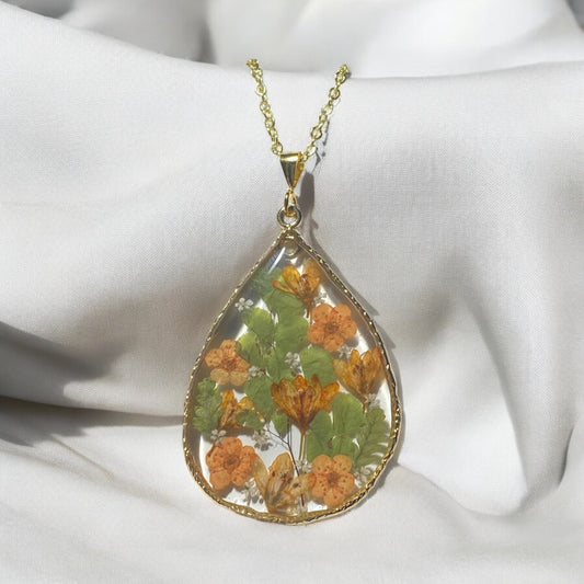 Dry Pressed Leaves with Orange Plum Blossoms and Orange Wild Flowers with pieces of Queen Anne’s Lace