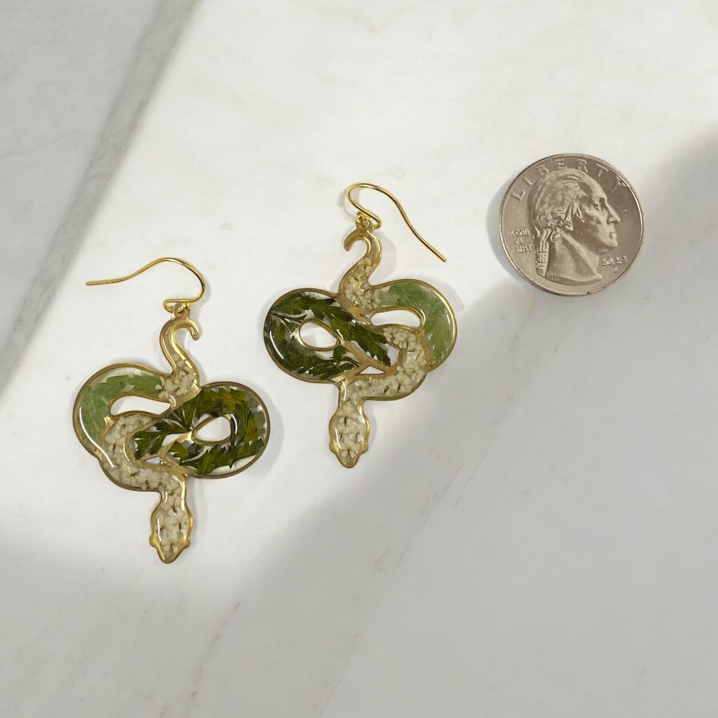 Snake Shape filled with pieces of Queen Anne’s Lace and Fern